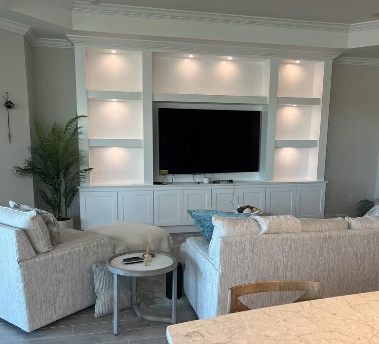 Clean custom built-in entertainment wall by AR ECS CORP